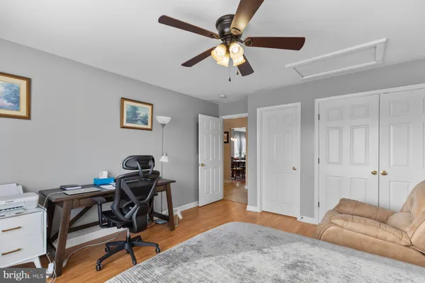 a bedroom with a workspace