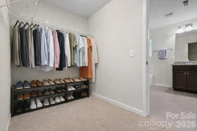 a bedroom with a bed and a table