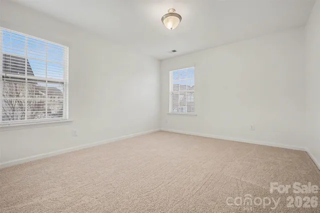 a bedroom with a bed and a desk