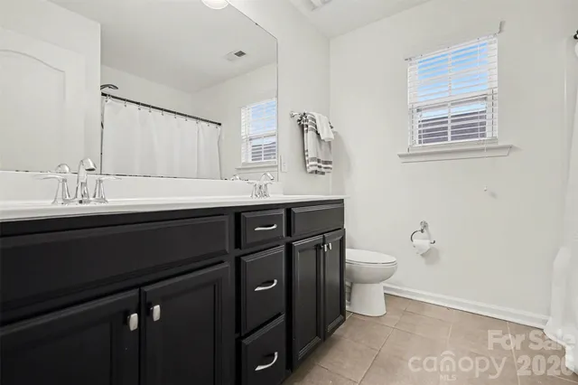 a view of a house with a snow in the background