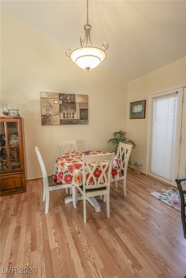 3201 La Mancha Way Henderson, NV 89014 - Photo 18 of 43 Dining space with lofted ceiling and light wood-style flooring