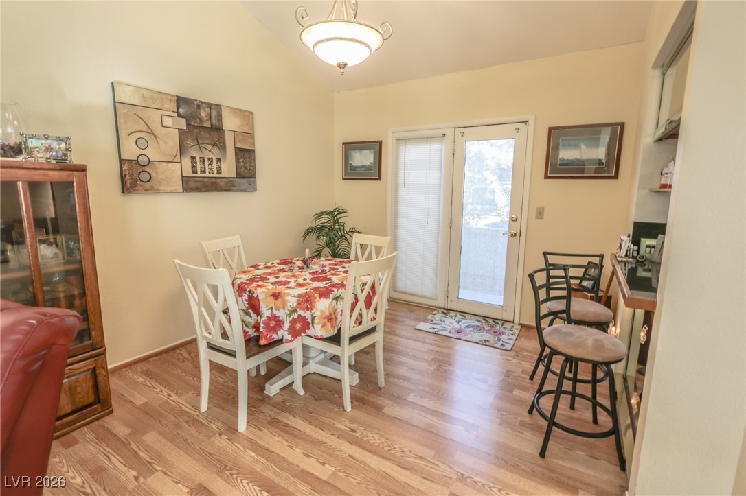 3201 La Mancha Way Henderson, NV 89014 - Photo 20 of 43 Dining area with light wood-type flooring and vaulted ceiling
