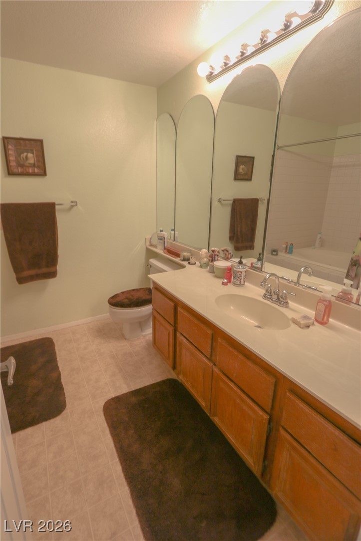 3201 La Mancha Way Henderson, NV 89014 - Photo 28 of 43 Full bathroom with vanity and light tile patterned floors