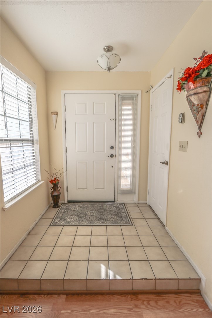 3201 La Mancha Way Henderson, NV 89014 - Photo 29 of 43 Entryway featuring light tile patterned flooring and baseboards