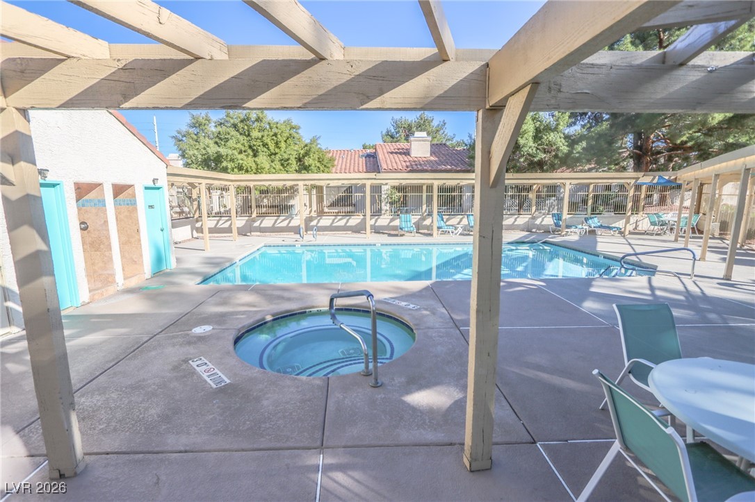 3201 La Mancha Way Henderson, NV 89014 - Photo 37 of 43 Community pool with a patio, a pergola, and a community hot tub