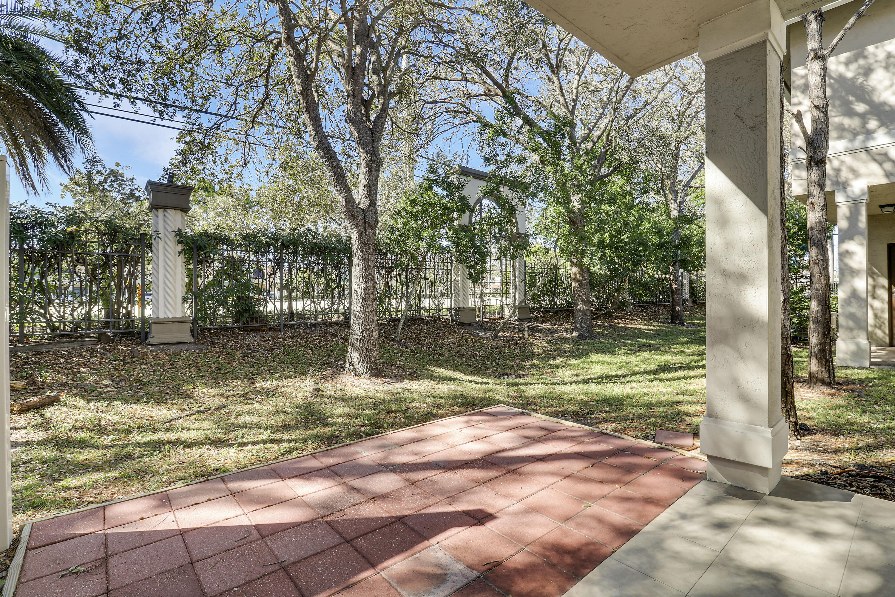 4170 Napoli Lake Drive Riviera Beach, FL 33410 - Photo 27 of 36 a view of a yard with plants