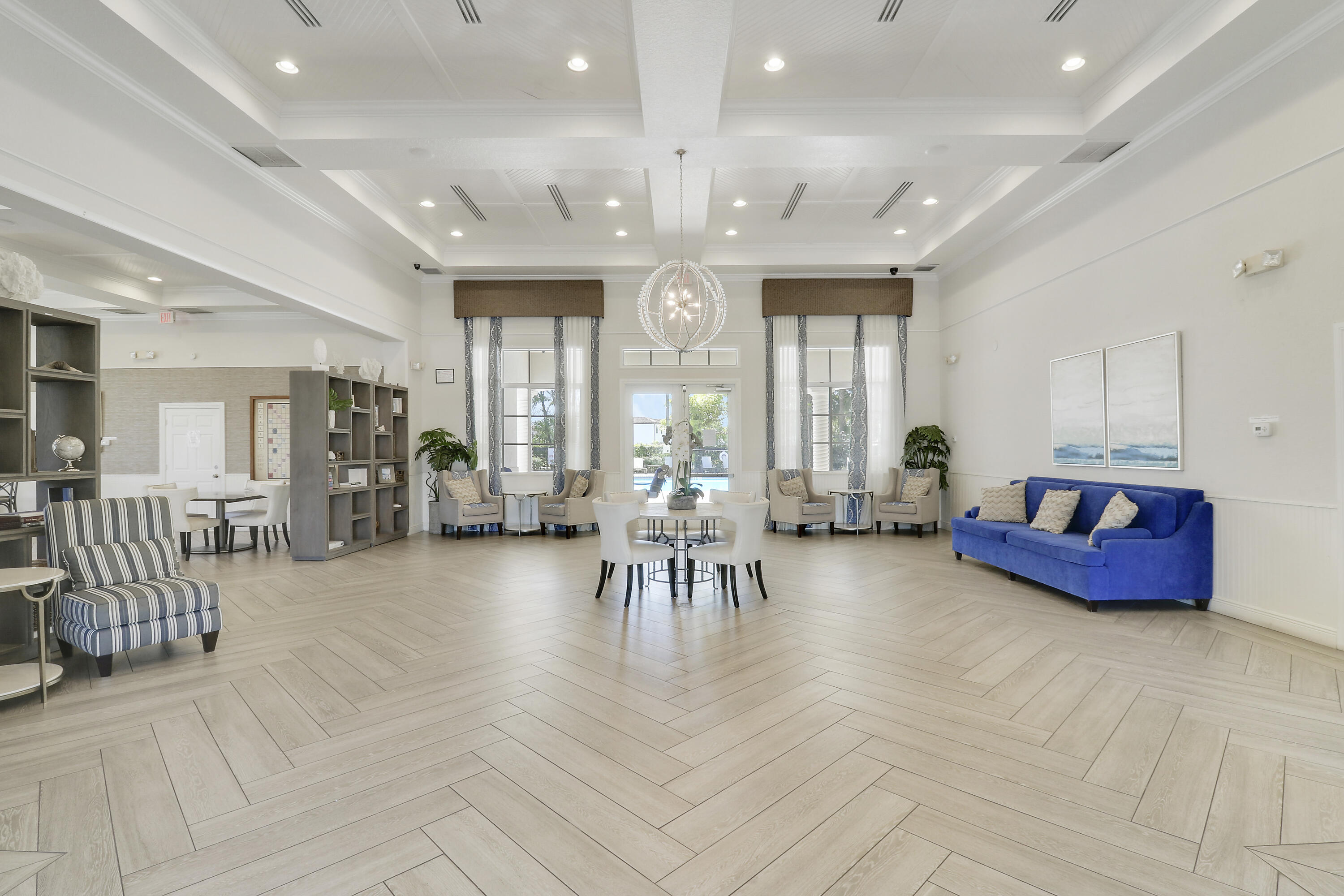 4170 Napoli Lake Drive Riviera Beach, FL 33410 - Photo 29 of 36 a living room with furniture and large windows
