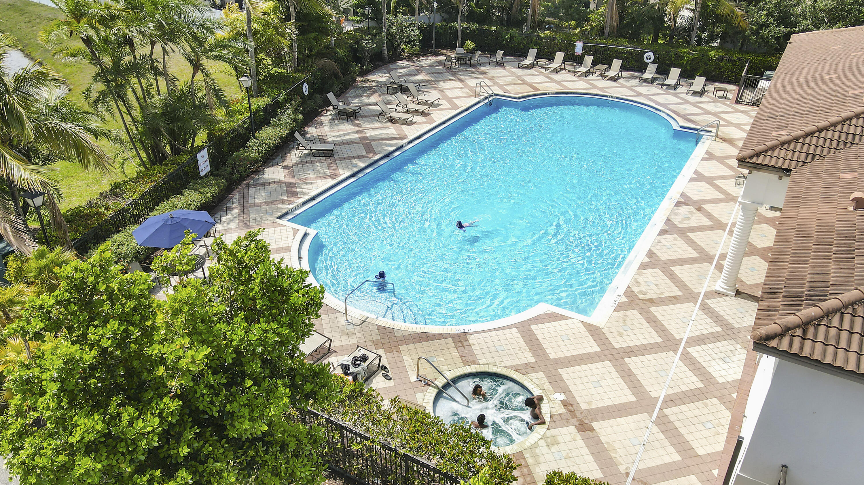4170 Napoli Lake Drive Riviera Beach, FL 33410 - Photo 33 of 36 a view of swimming pool with a garden