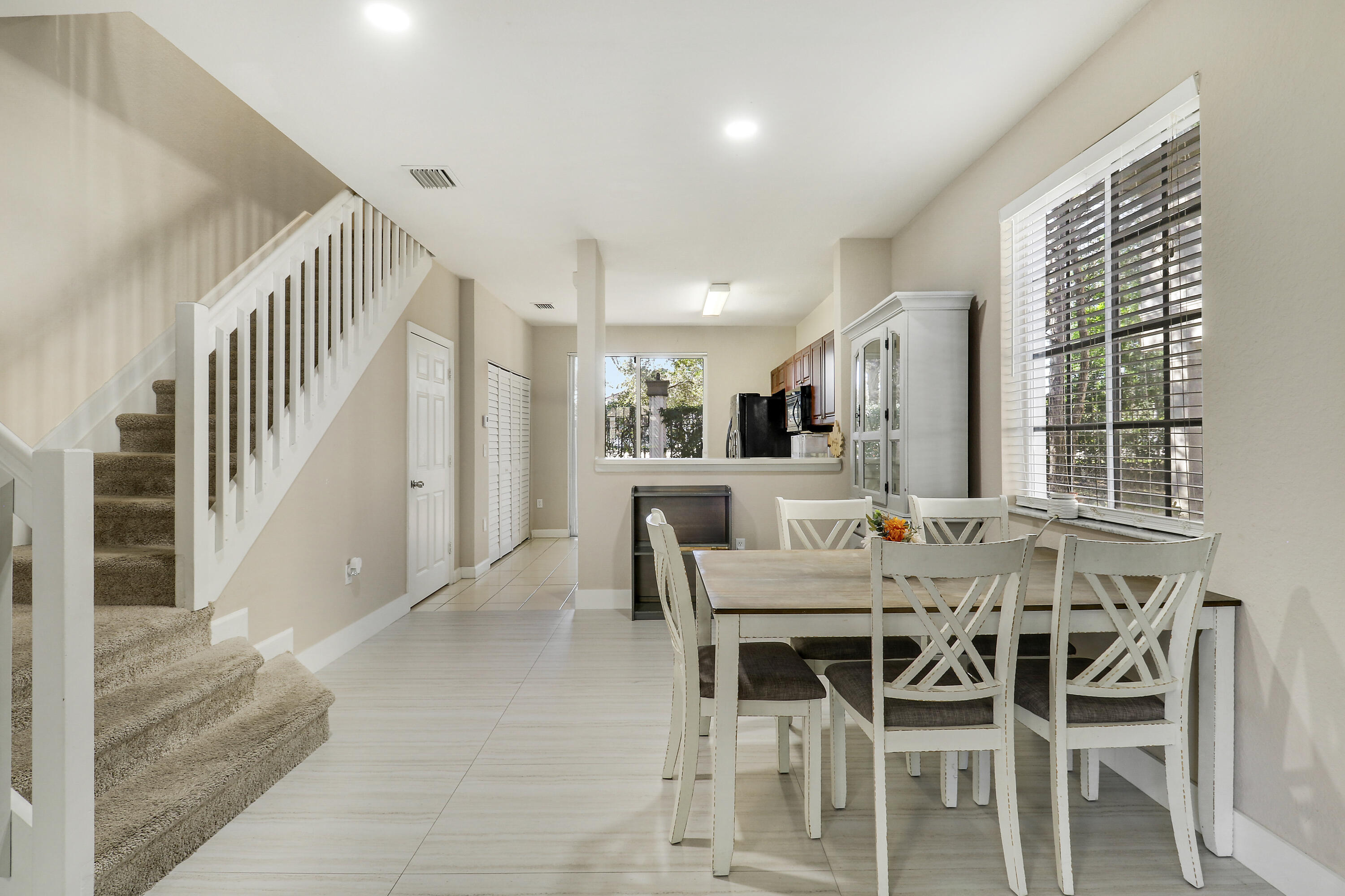 4170 Napoli Lake Drive Riviera Beach, FL 33410 - Photo 10 of 36 a view of a dining room with furniture