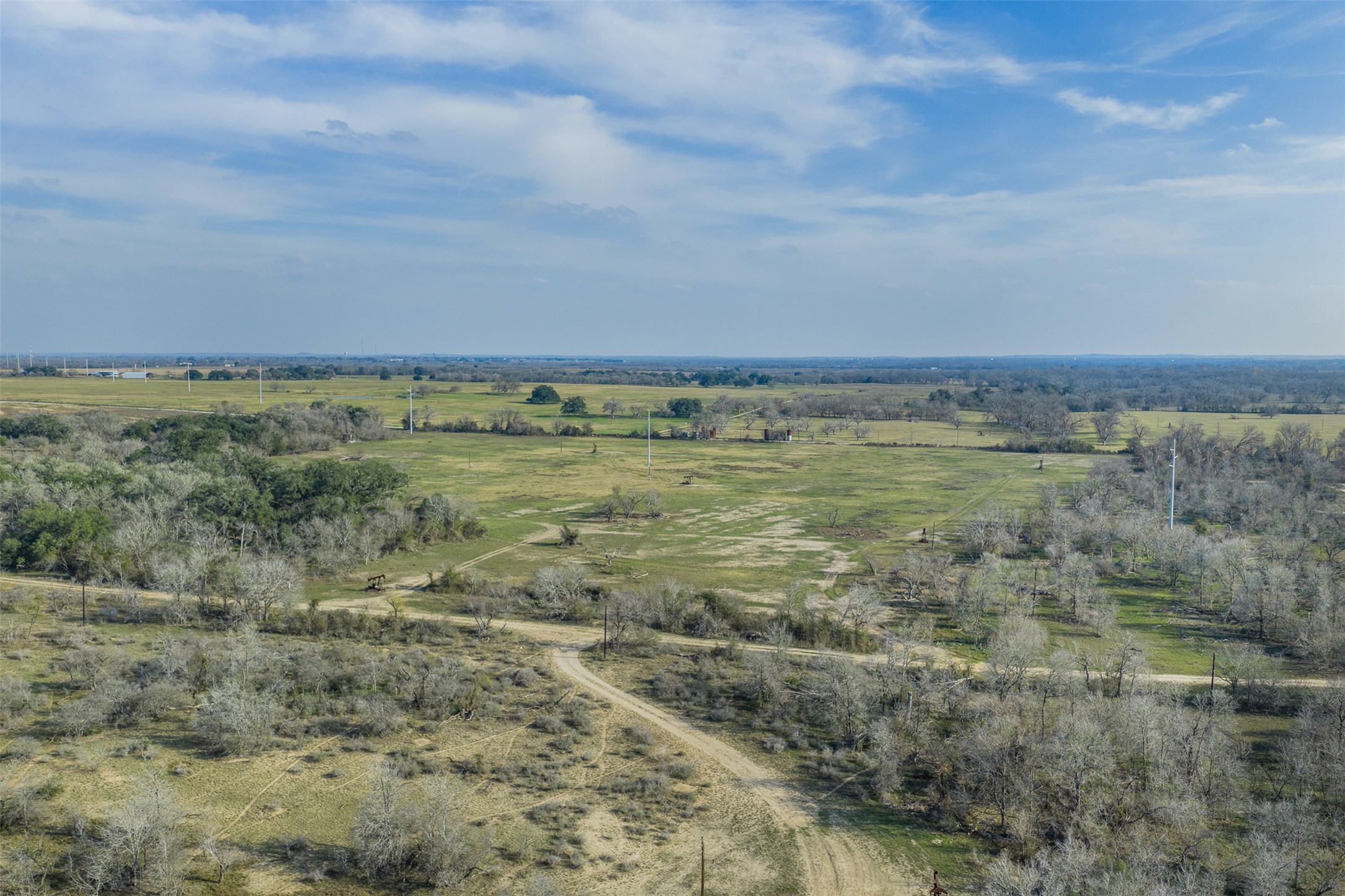 1144 Treetop Lane Luling, TX 78648 - Photo 20 of 31 Aerial view of property and surrounding area with rural landscape