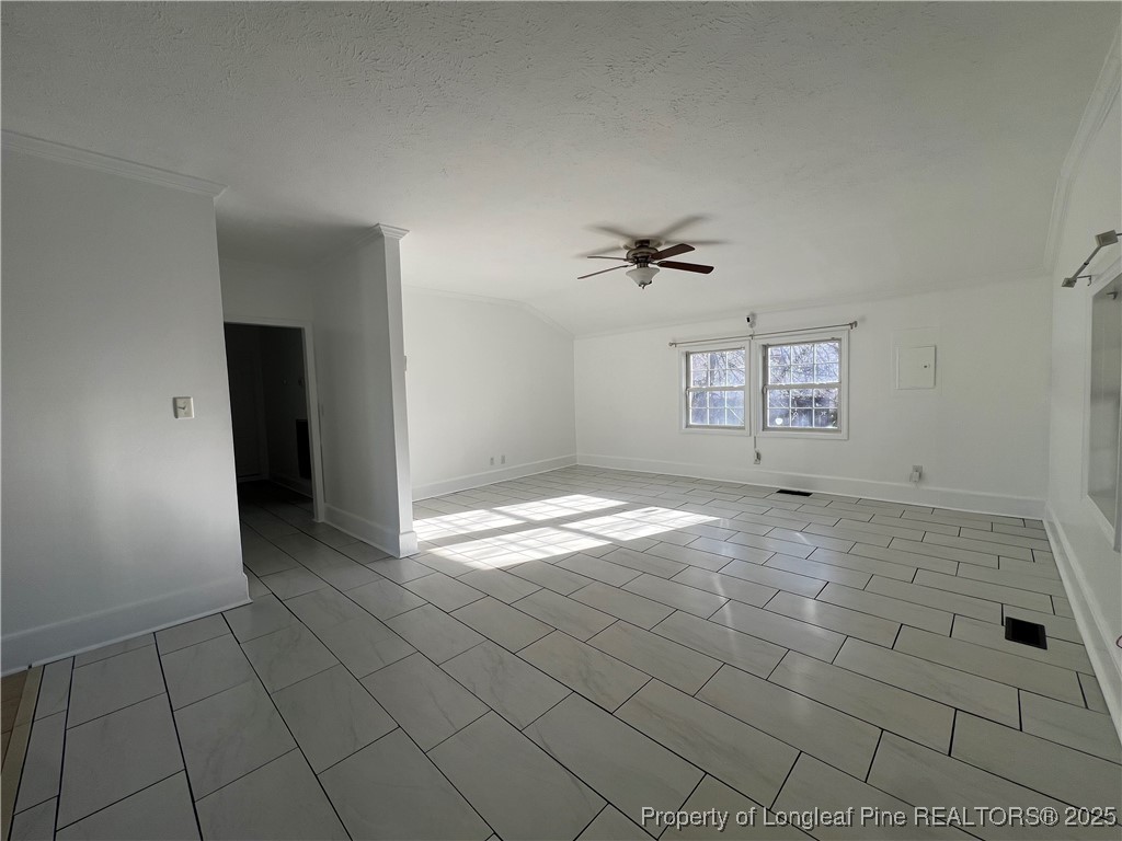 1443 Strickland Bridge Road Fayetteville, NC 28304 - Photo 4 of 10 an empty room with a empty space and windows