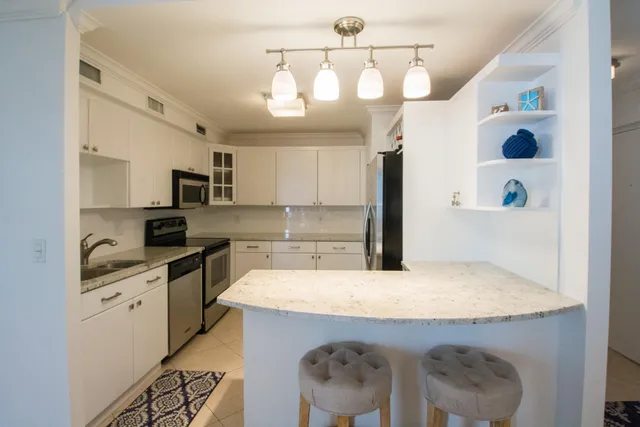 a bedroom with a bed and a lamp