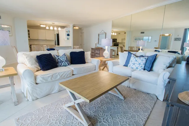 a living room with furniture a window and a fireplace