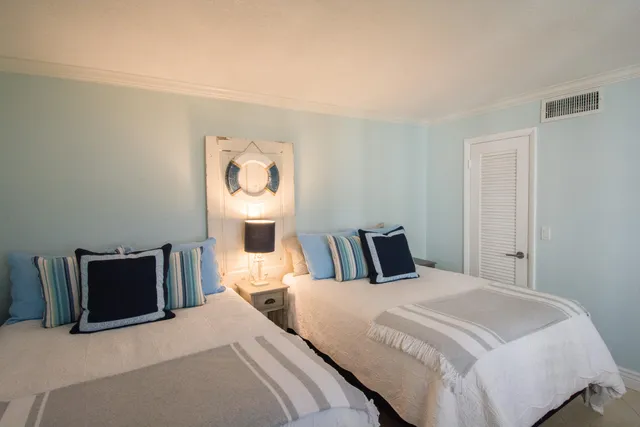 a bedroom with a bed and a television