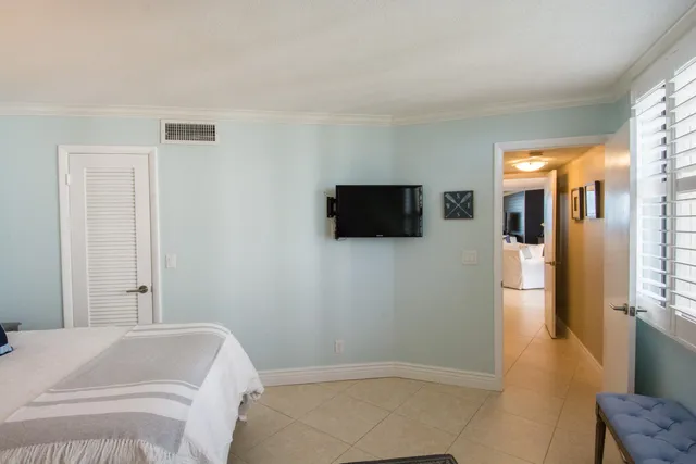 a bench sitting in a room next to a window