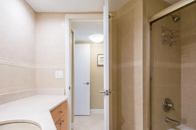 a bathroom with a sink a shower and a mirror