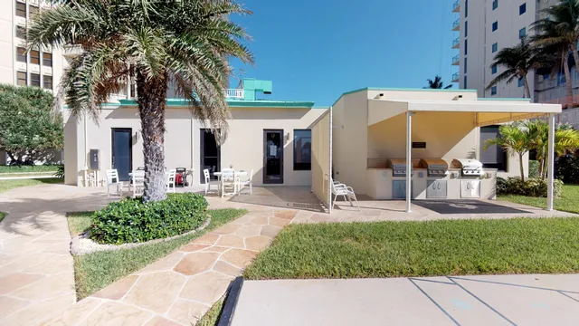 a view of a dinning area with table and chairs