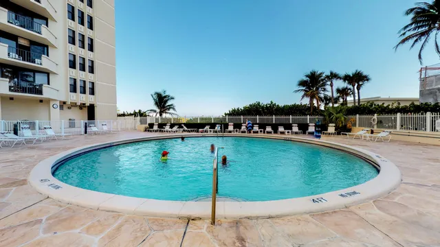 an aerial view of a house with a yard and a garage