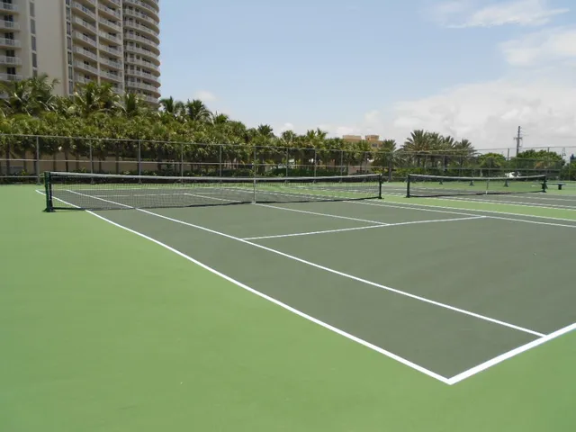 a view of a room and a kitchen island