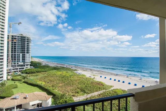 a view of a balcony with chair and table