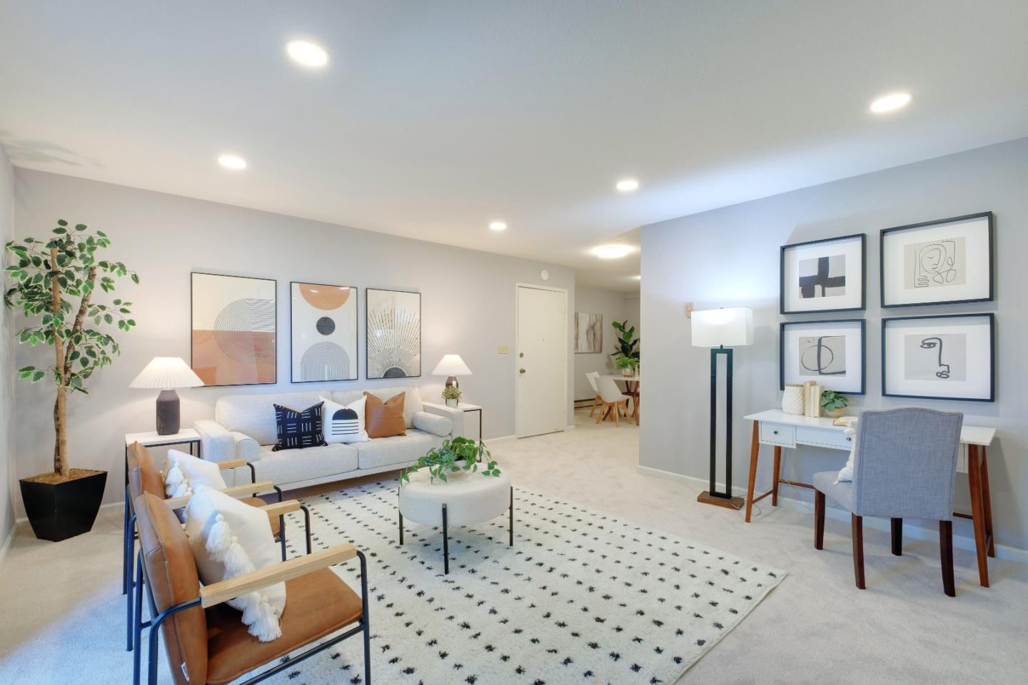 a living room with furniture and a rug