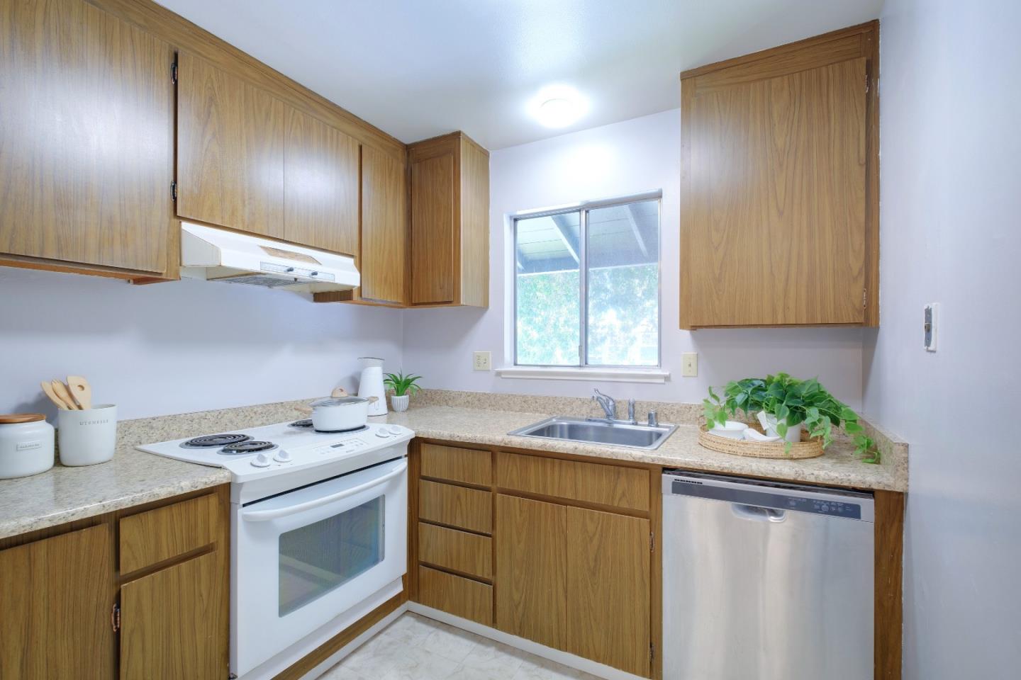 50 East Middlefield Road, Unit 40 Mountain View, CA 94043 - Photo 20 of 41 a kitchen with stainless steel appliances a sink stove and cabinets