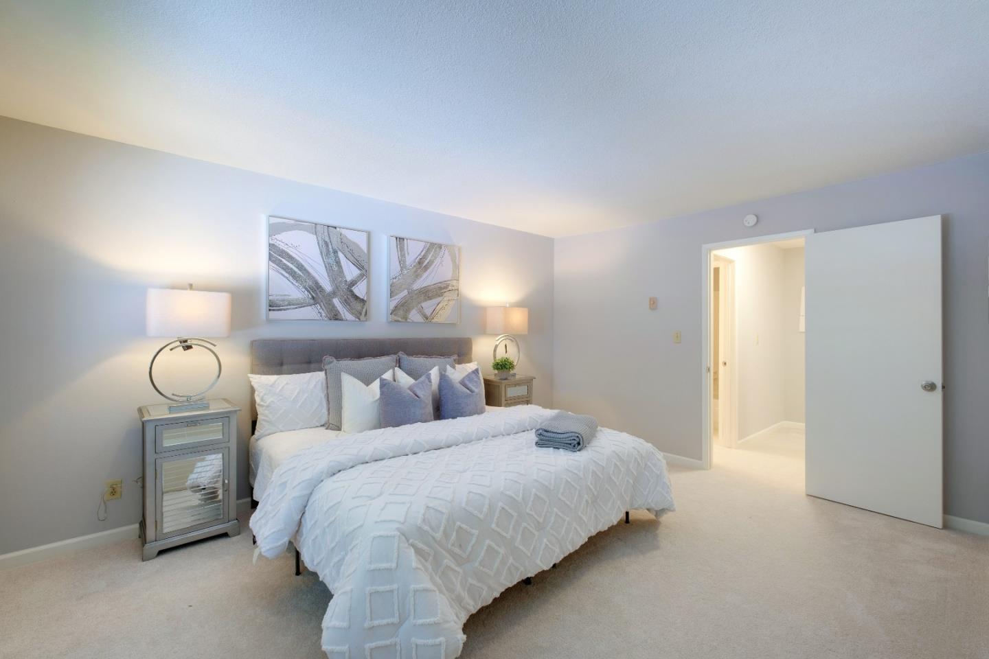 50 East Middlefield Road, Unit 40 Mountain View, CA 94043 - Photo 28 of 41 a bedroom with a bed and painting on the wall