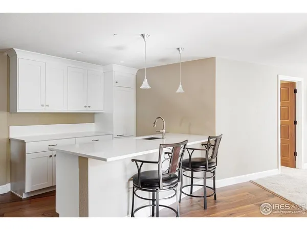 a utility room with sink dryer and washer