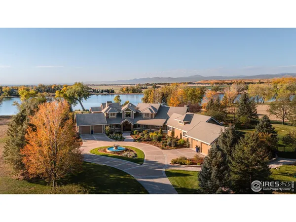 a aerial view of a house with a lake view