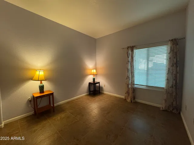 a bathroom with a granite countertop sink a toilet and bathtub