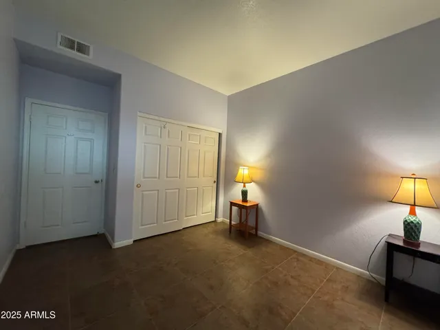 a bathroom with a tub and a toilet