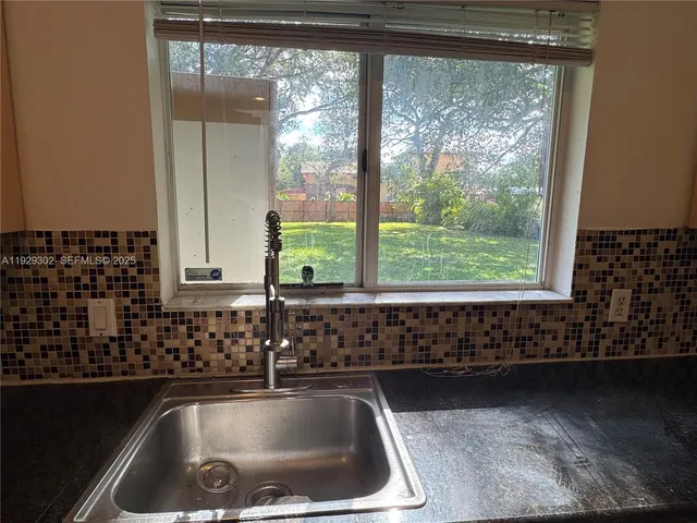 a bathroom with a sink and a bathtub