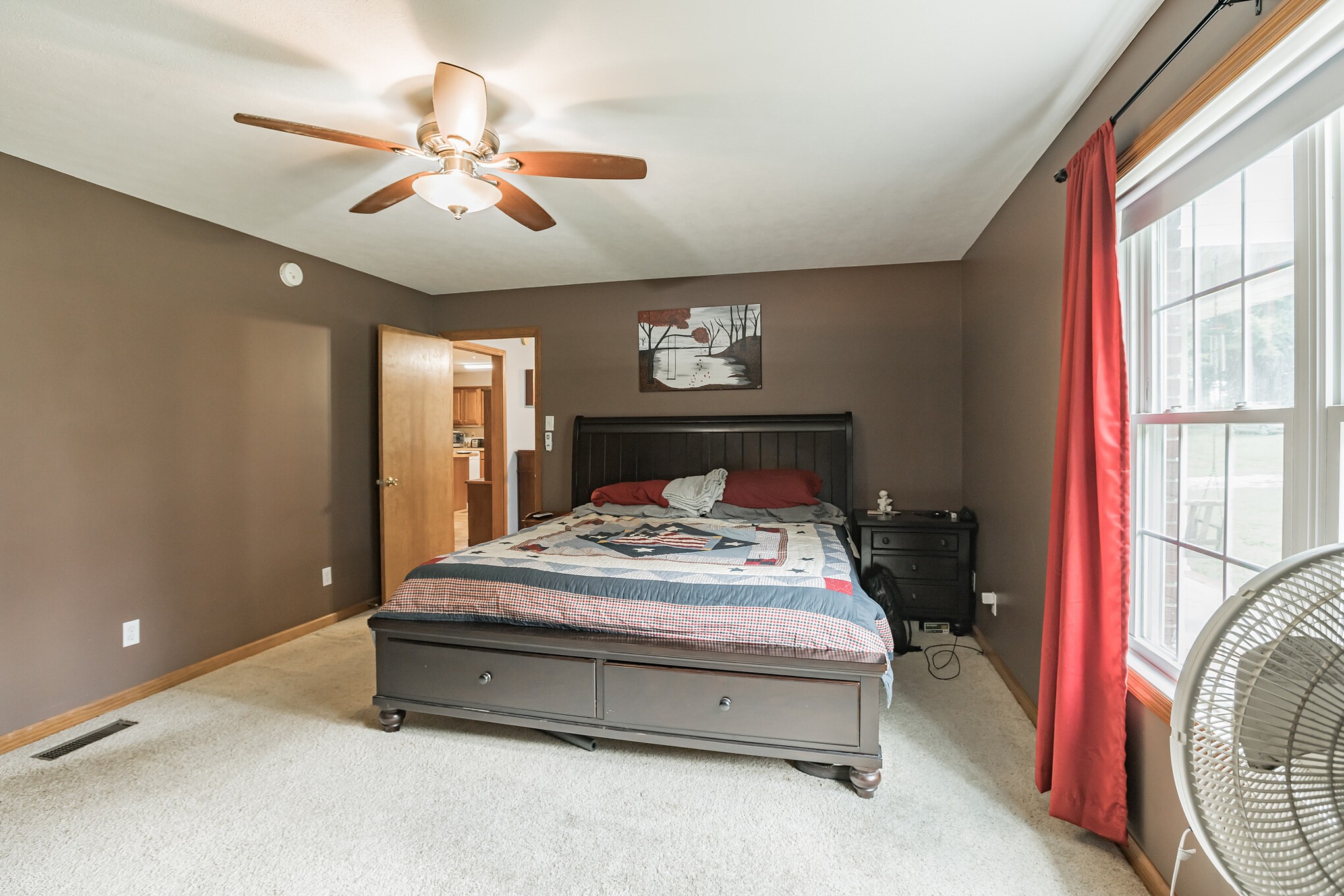 420 Sands Road Pulaski, TN 38478 - Photo 20 of 36 a spacious bedroom with a bed and a chandelier