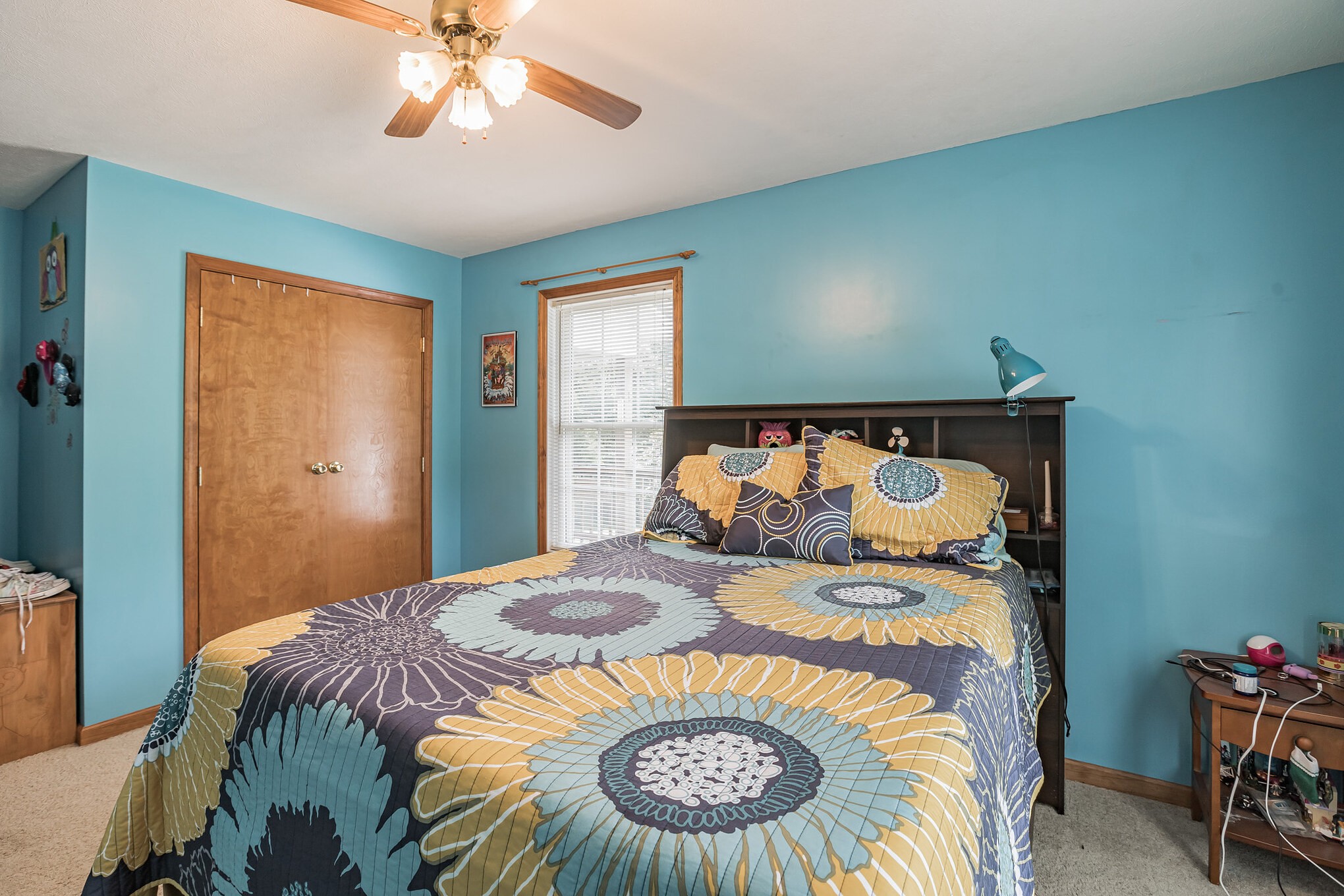 420 Sands Road Pulaski, TN 38478 - Photo 26 of 36 a bedroom with a bed and a chandelier