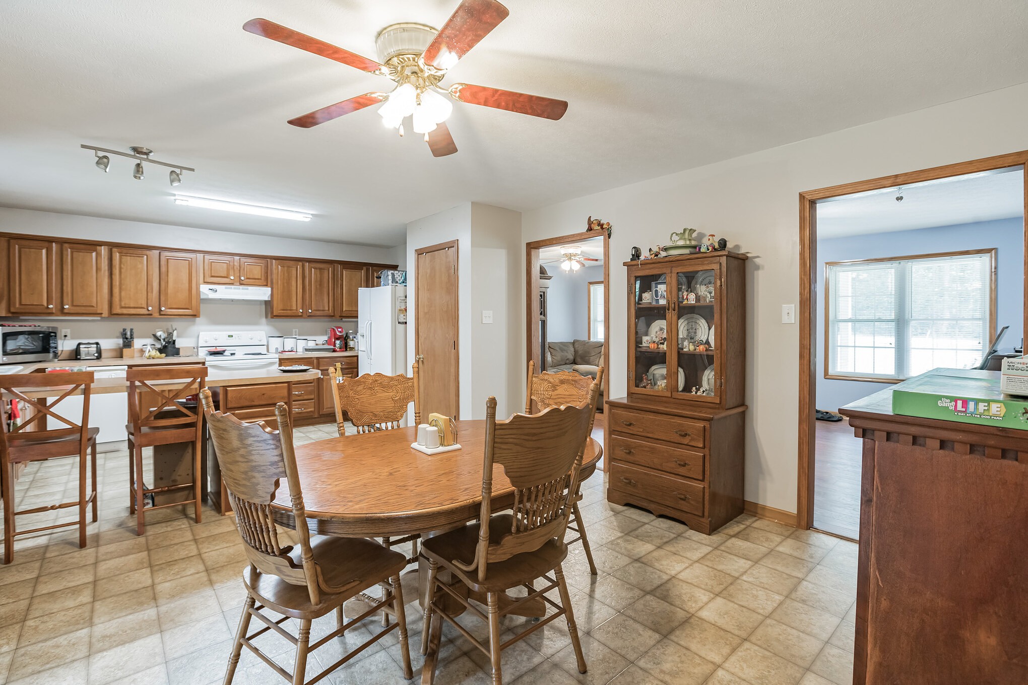 420 Sands Road Pulaski, TN 38478 - Photo 28 of 36 a dining area with stainless steel appliances kitchen island granite countertop a dining table and chairs