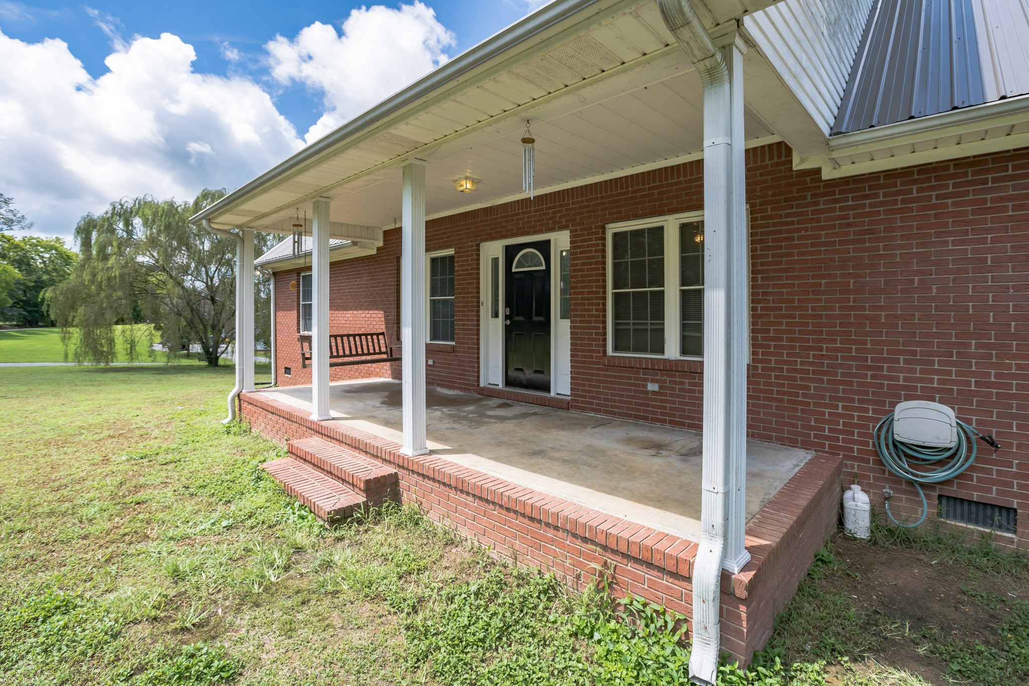420 Sands Road Pulaski, TN 38478 - Photo 4 of 36 a front view of a house with garden