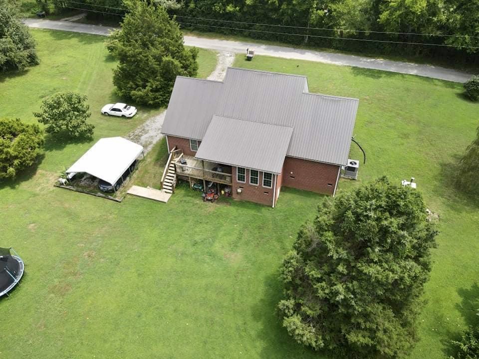 420 Sands Road Pulaski, TN 38478 - Photo 33 of 36 an aerial view of a house with swimming pool garden and outdoor seating