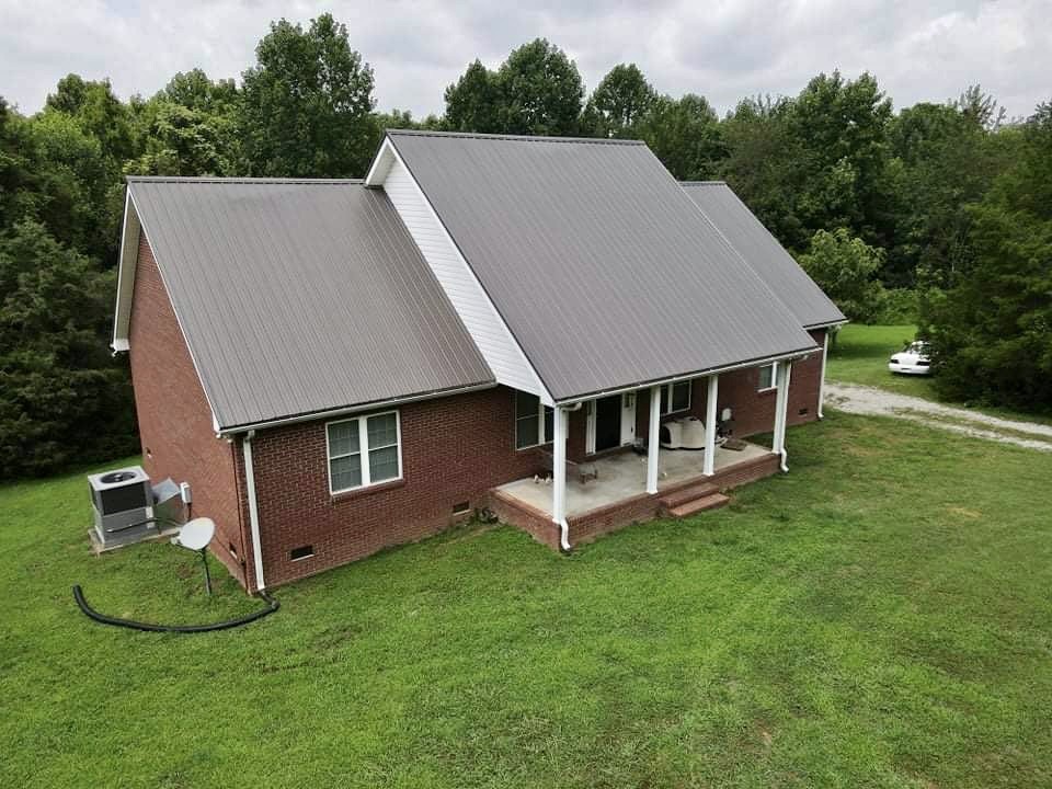 420 Sands Road Pulaski, TN 38478 - Photo 35 of 36 an aerial view of a house with a yard table and chairs