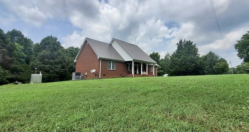 420 Sands Road Pulaski, TN 38478 - Photo 36 of 36 a view of a house with backyard and garden