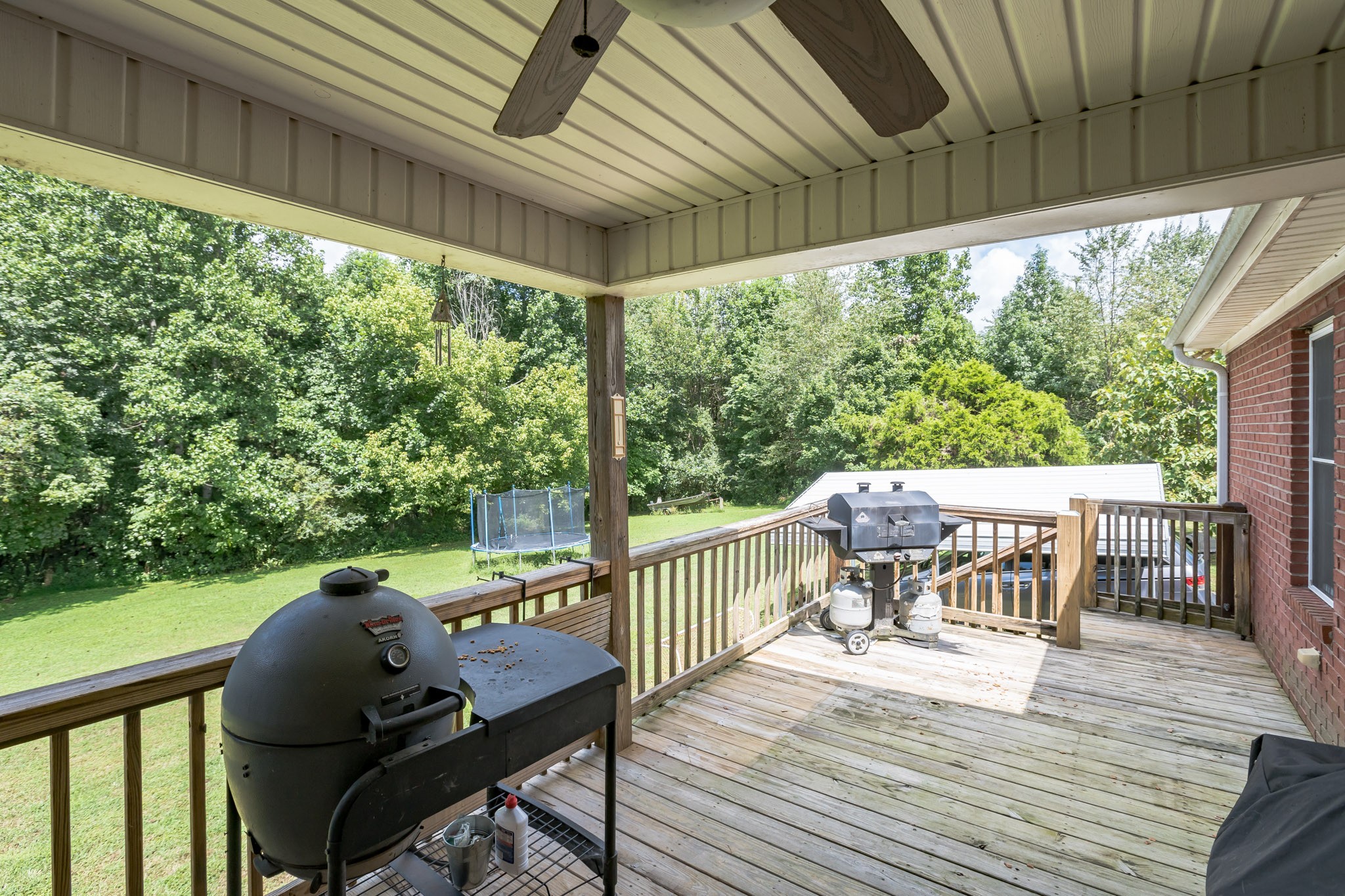 420 Sands Road Pulaski, TN 38478 - Photo 10 of 36 a view of a balcony with chairs and wooden floor