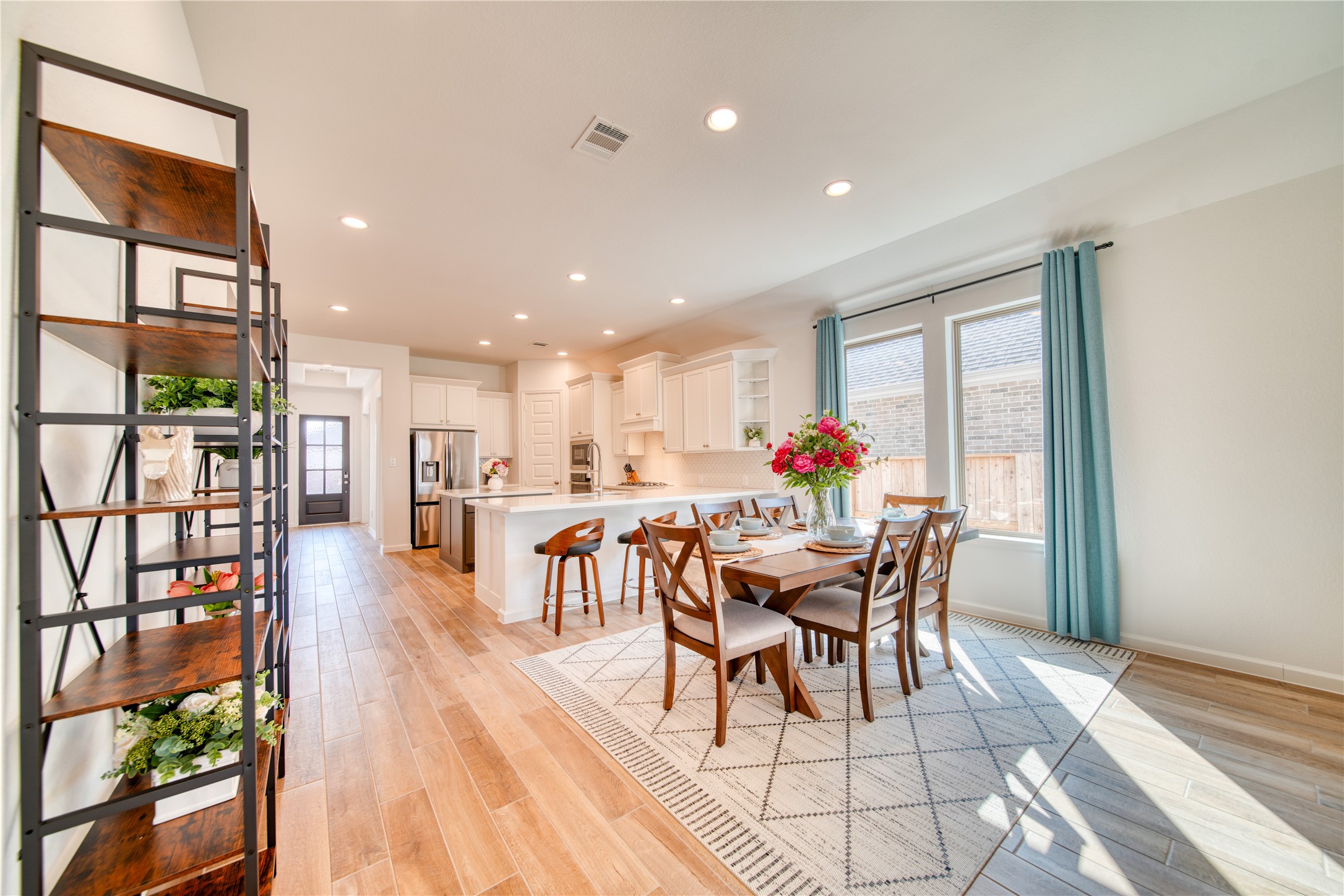 9018 Moose Trail Manvel, TX 77578 - Photo 11 of 37 a dining room with furniture entryway and wooden floor