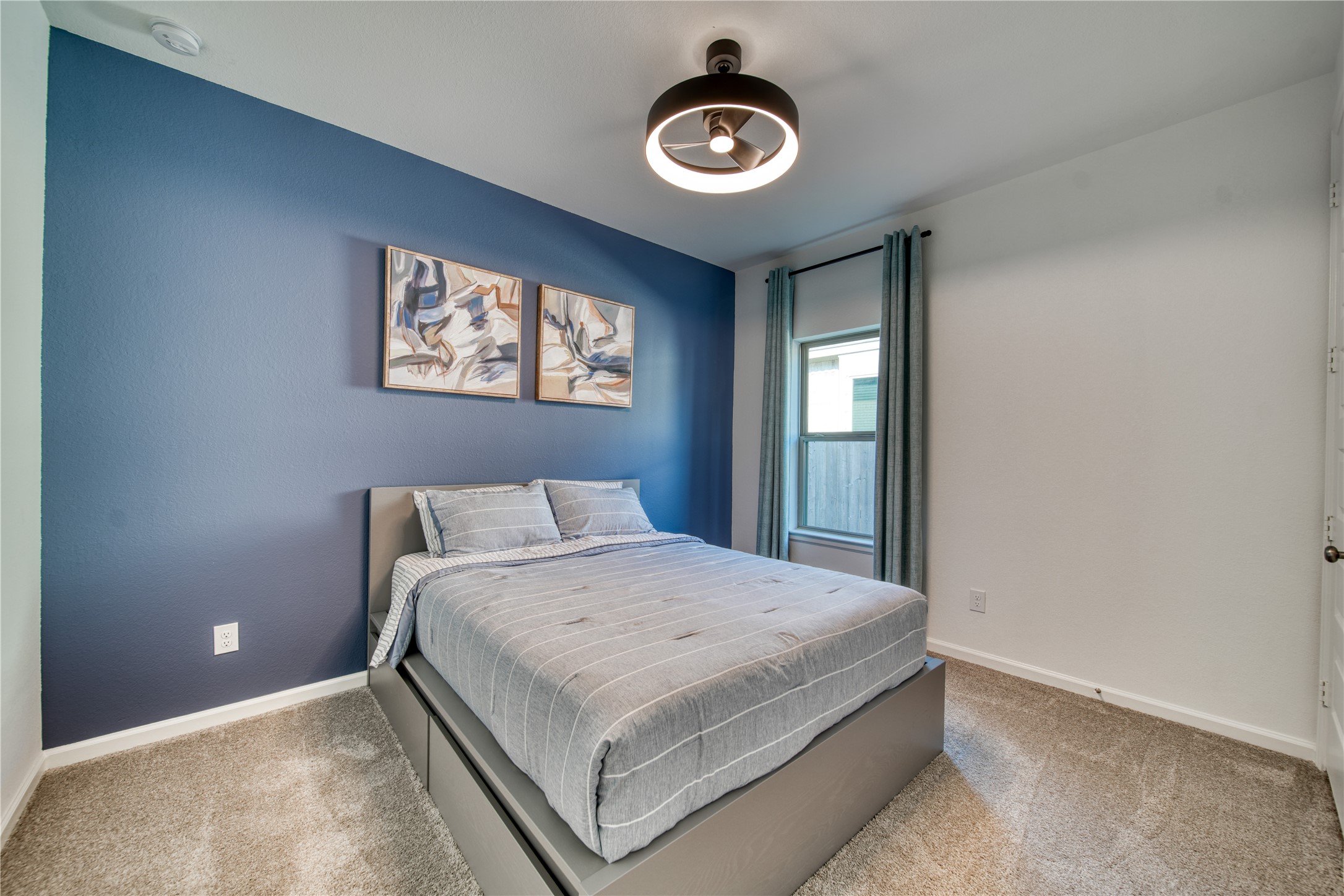 9018 Moose Trail Manvel, TX 77578 - Photo 21 of 37 a bedroom with a bed and a window