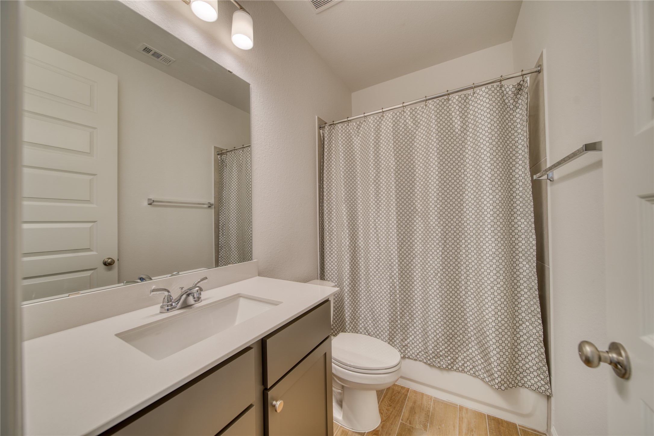 9018 Moose Trail Manvel, TX 77578 - Photo 23 of 37 a bathroom with a sink and a mirror