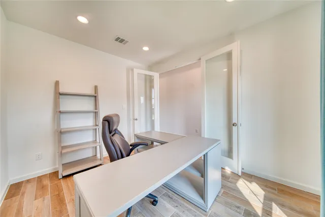 a view of a kitchen with a sink and cabinets