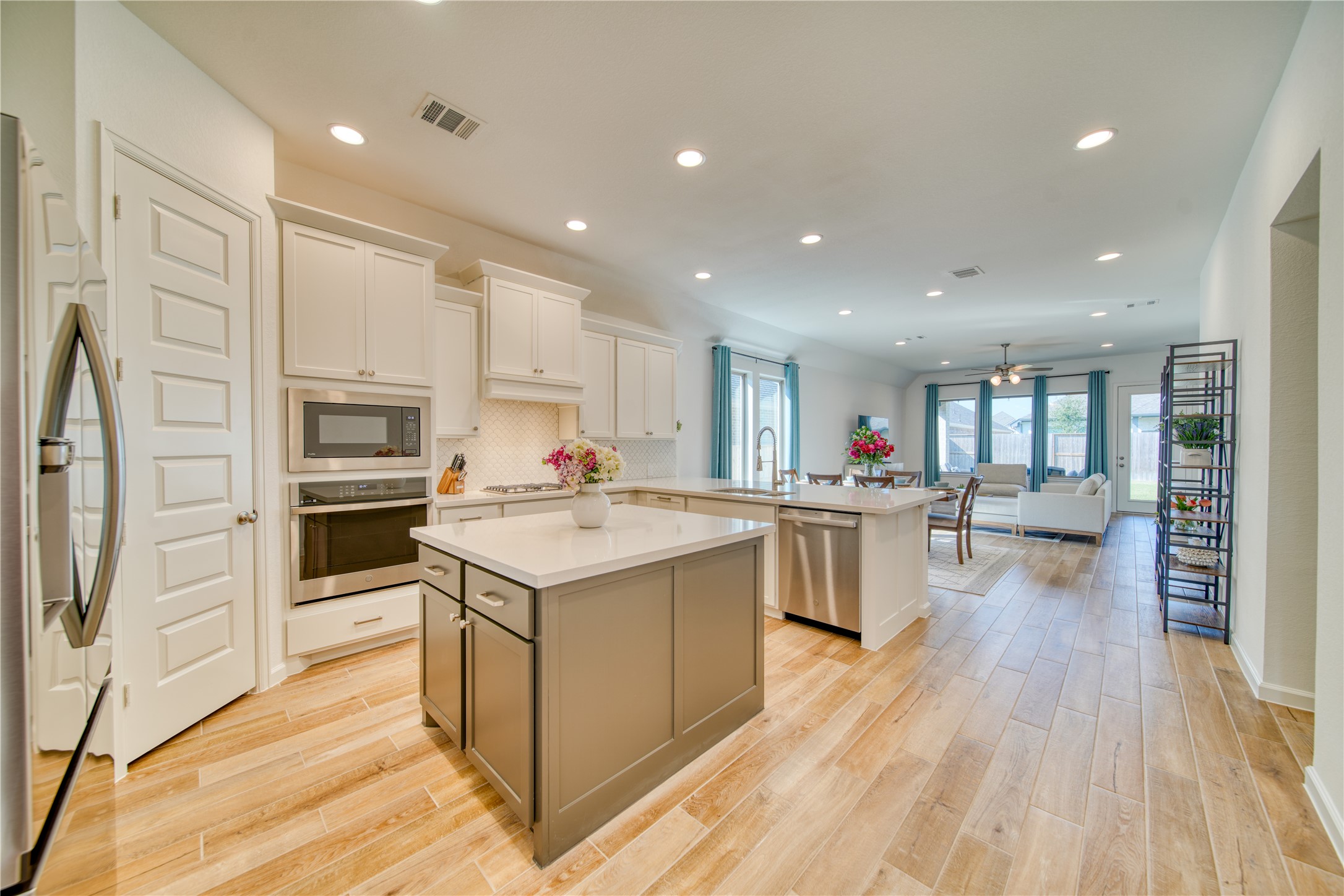 9018 Moose Trail Manvel, TX 77578 - Photo 7 of 37 a kitchen with a sink stainless steel appliances and cabinets