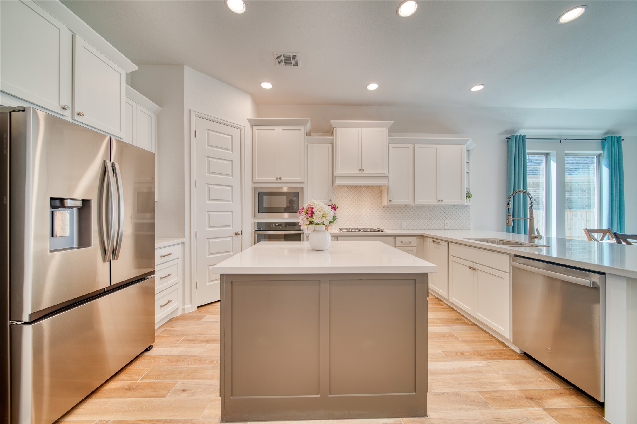 9018 Moose Trail Manvel, TX 77578 - Photo 8 of 37 a kitchen with stainless steel appliances granite countertop a sink stove and refrigerator