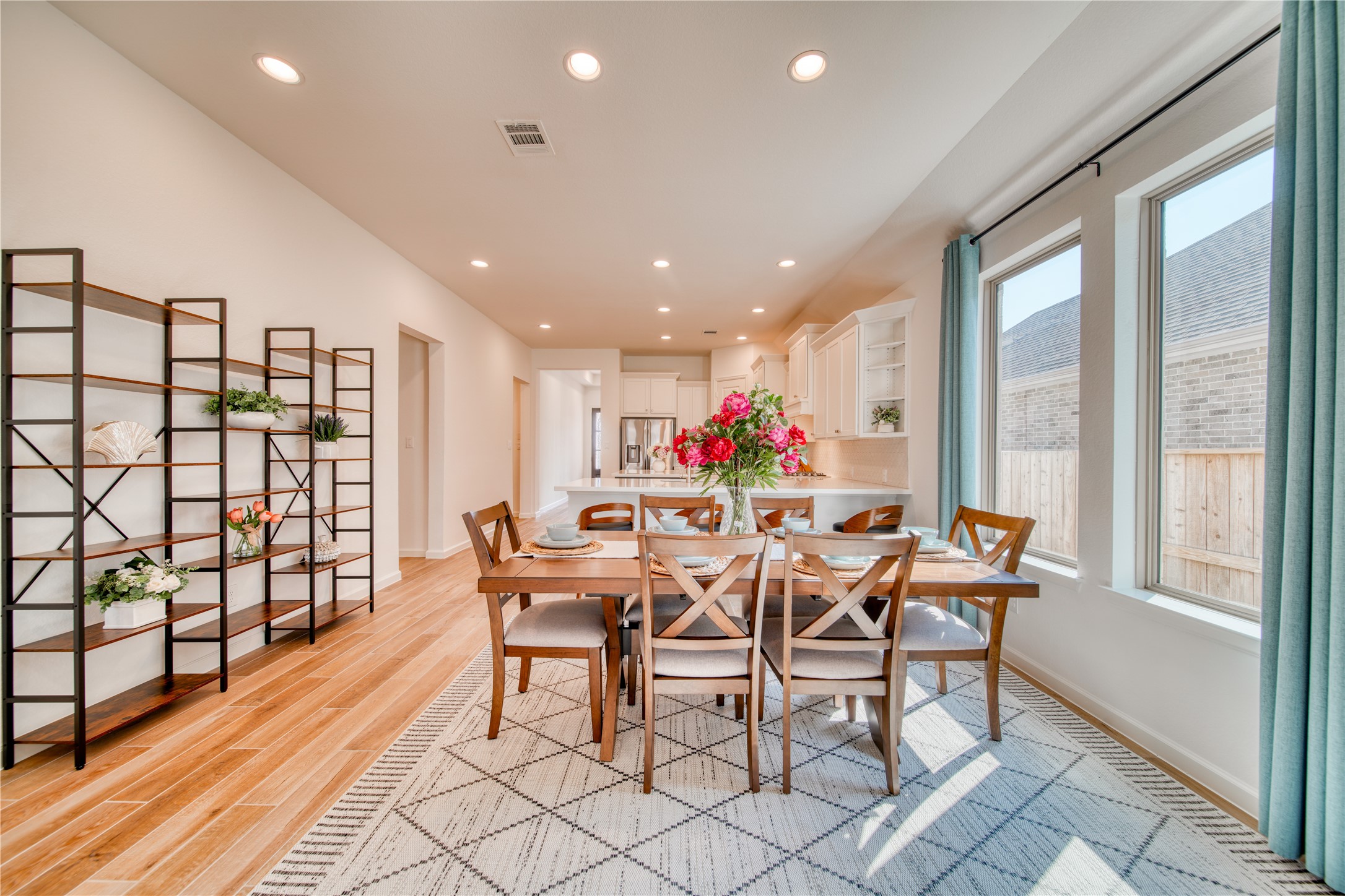 9018 Moose Trail Manvel, TX 77578 - Photo 10 of 37 a dining room with furniture and a floor to ceiling window