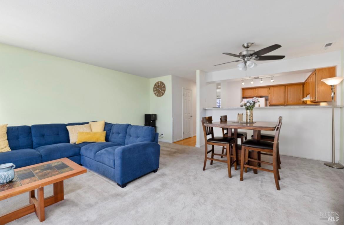 605 Laurel Grove Circle Santa Rosa, CA 95407 - Photo 7 of 29 a living room with furniture and a dining table with stainless steel appliances