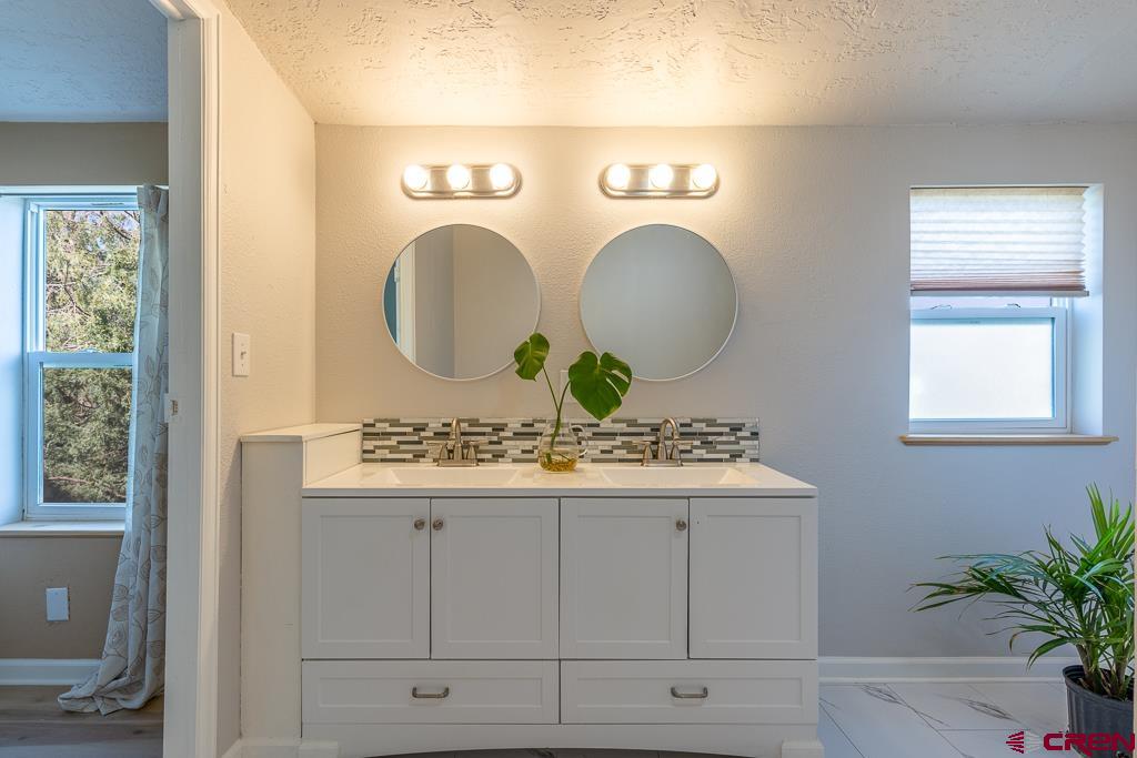 281 Alpine Drive Durango, CO 81301 - Photo 13 of 42 a bathroom with a sink and a mirror