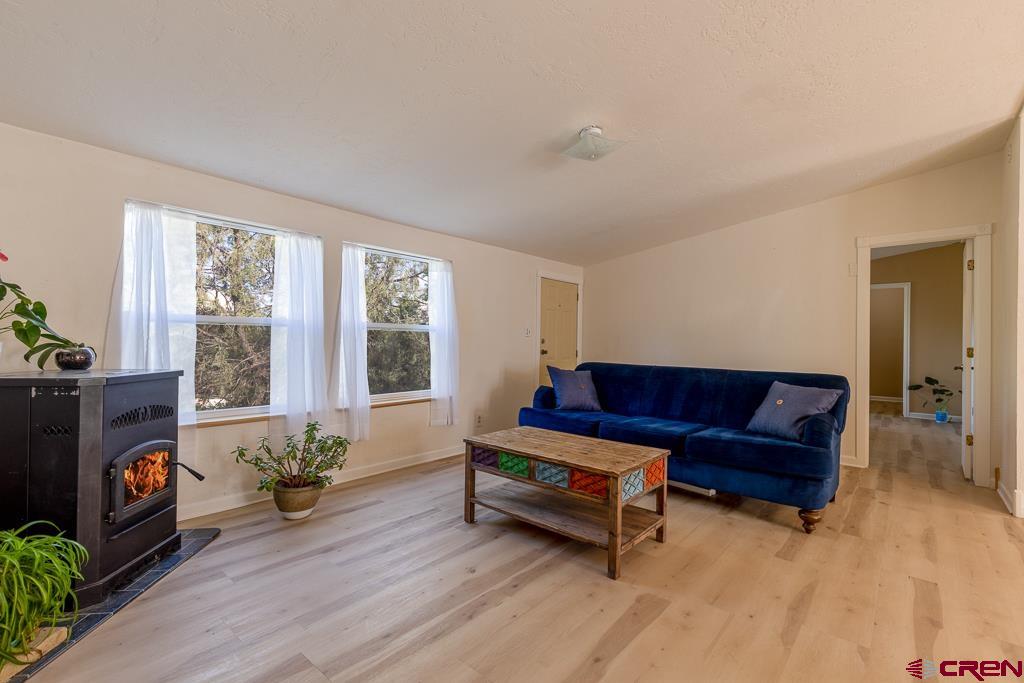 281 Alpine Drive Durango, CO 81301 - Photo 15 of 42 a living room with furniture and a fireplace